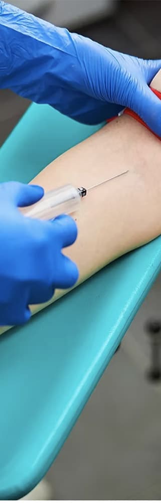 Syringe injecting into an arm