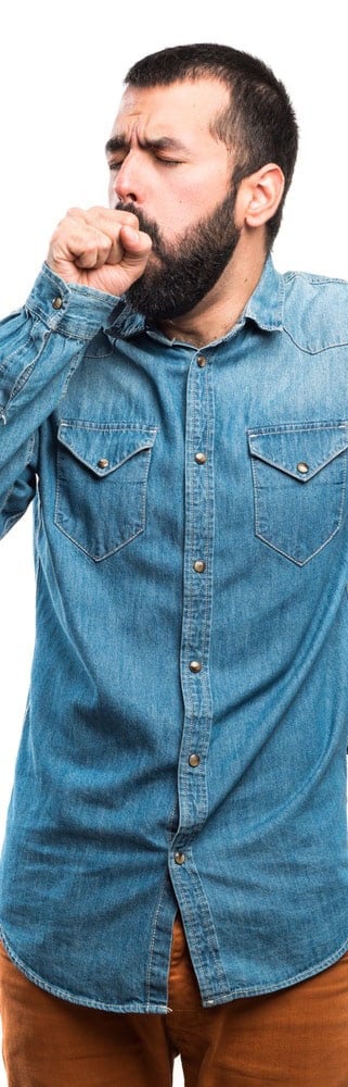 Person in denim shirt posing playfully.