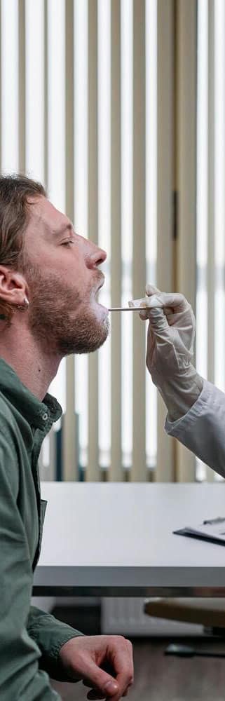 Medical professional administering a test.