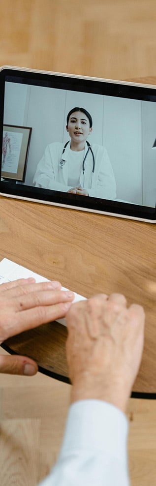 Person consulting doctor via video call.